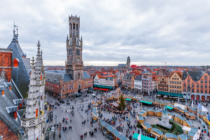 Cityscape and main square in Bruges, with the Belfry Tower.