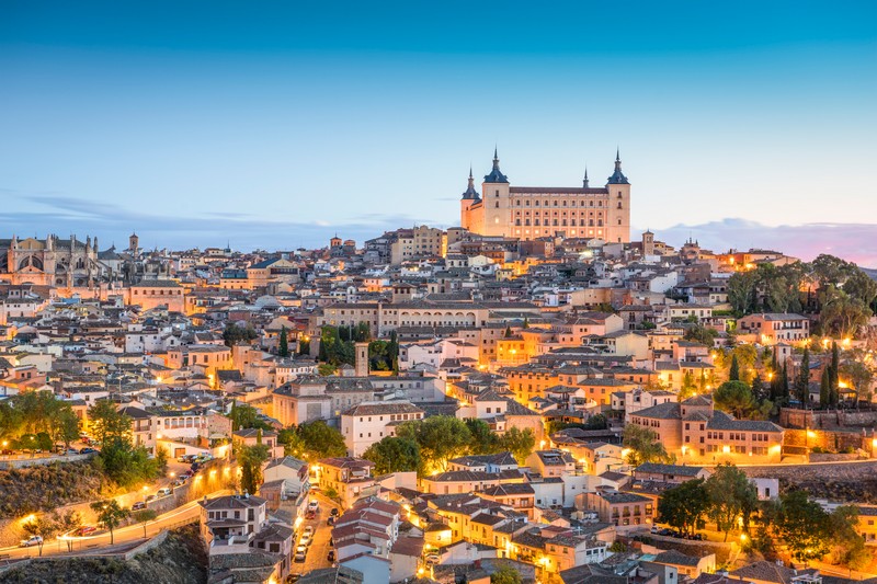 Toledo skyline with the Alcázar at dawn.